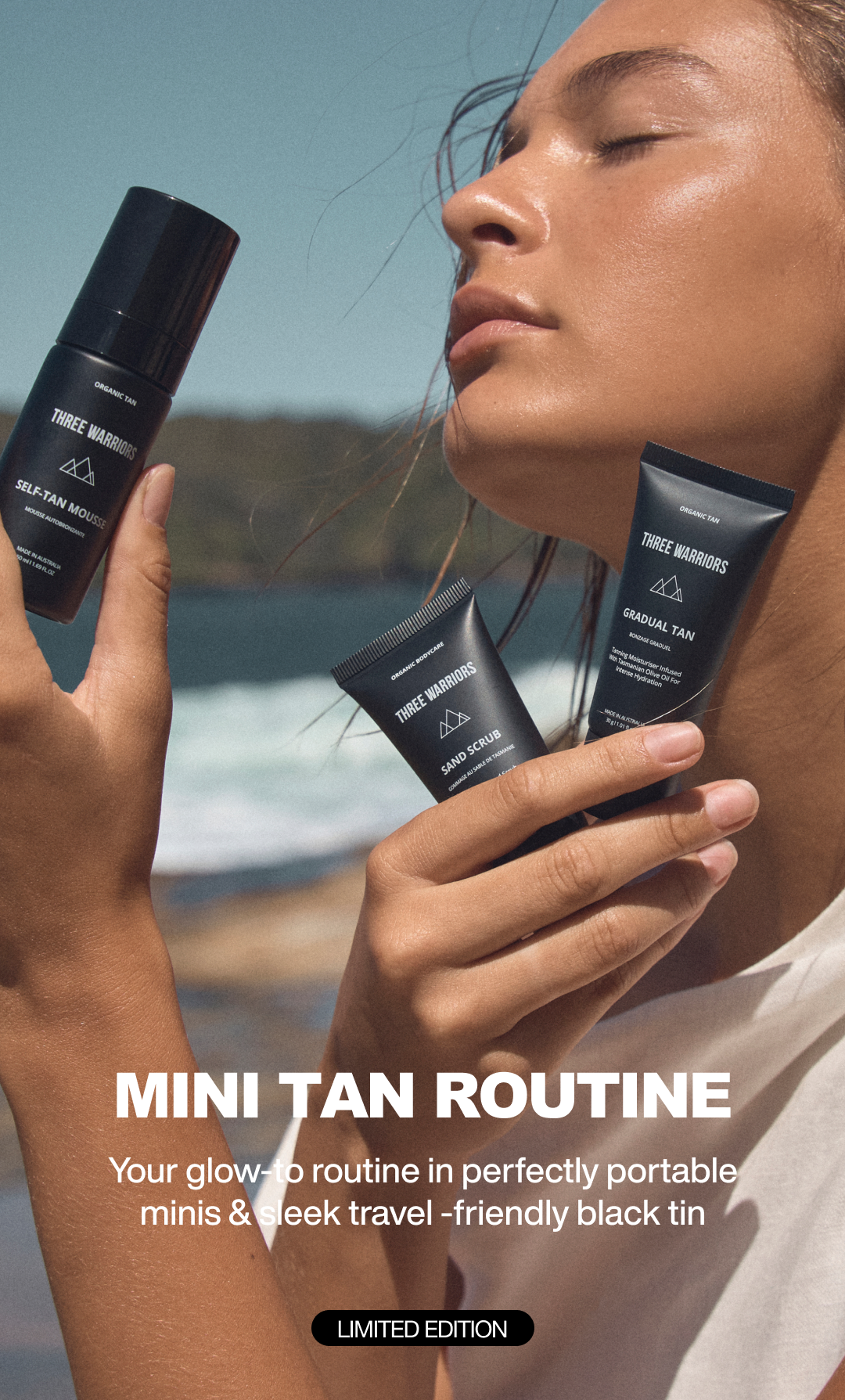 Person holding three black tanning products with a scenic background